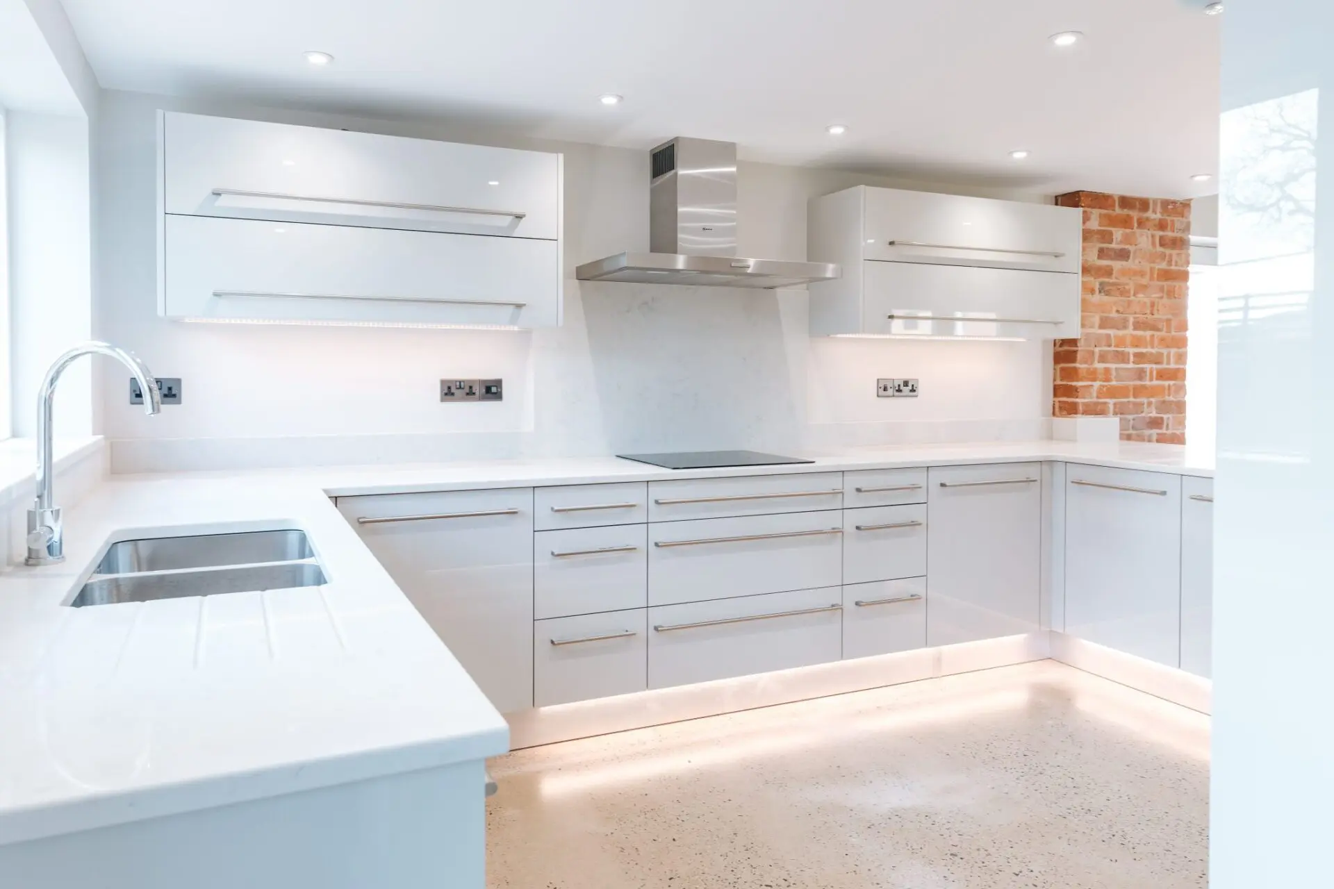 Industrial Kitchen Design With Brushed Metal Finishes Integrated Appliances And Open Plan Layout Bauhaus Collection
