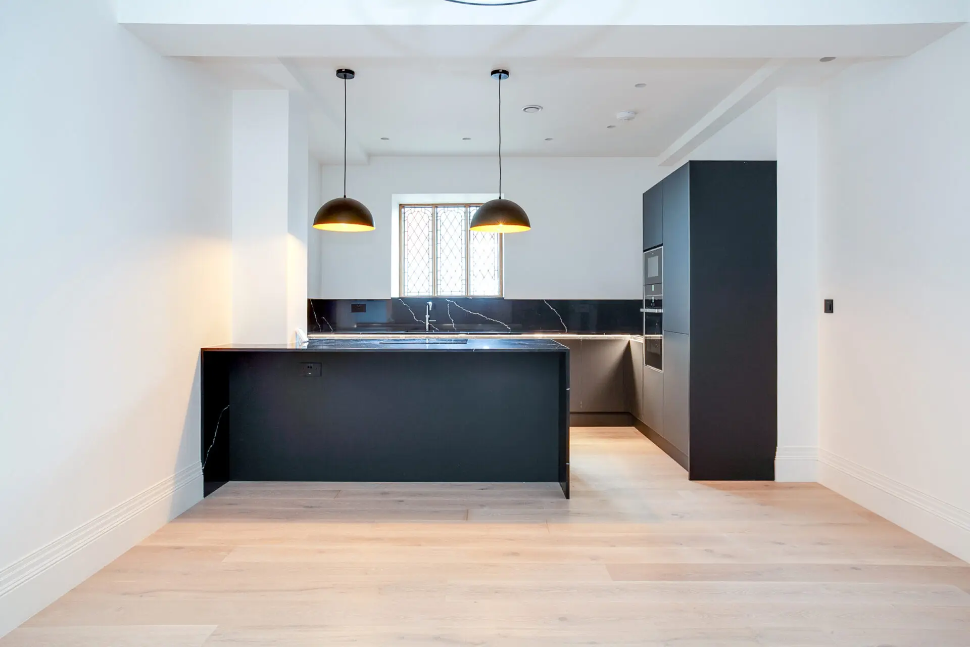 Linear Bauhaus Kitchen With Long Sightlines And Symmetrical Layout Creating A Sense Of Space And Calm