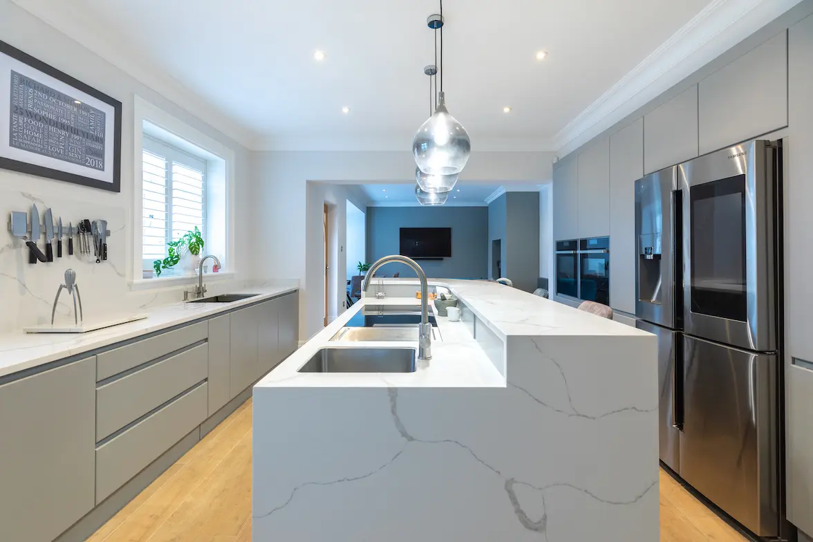 Modern Scandinavian Kitchen With Linear Cabinetry And Minimalist Design Marble Worktops And Surround