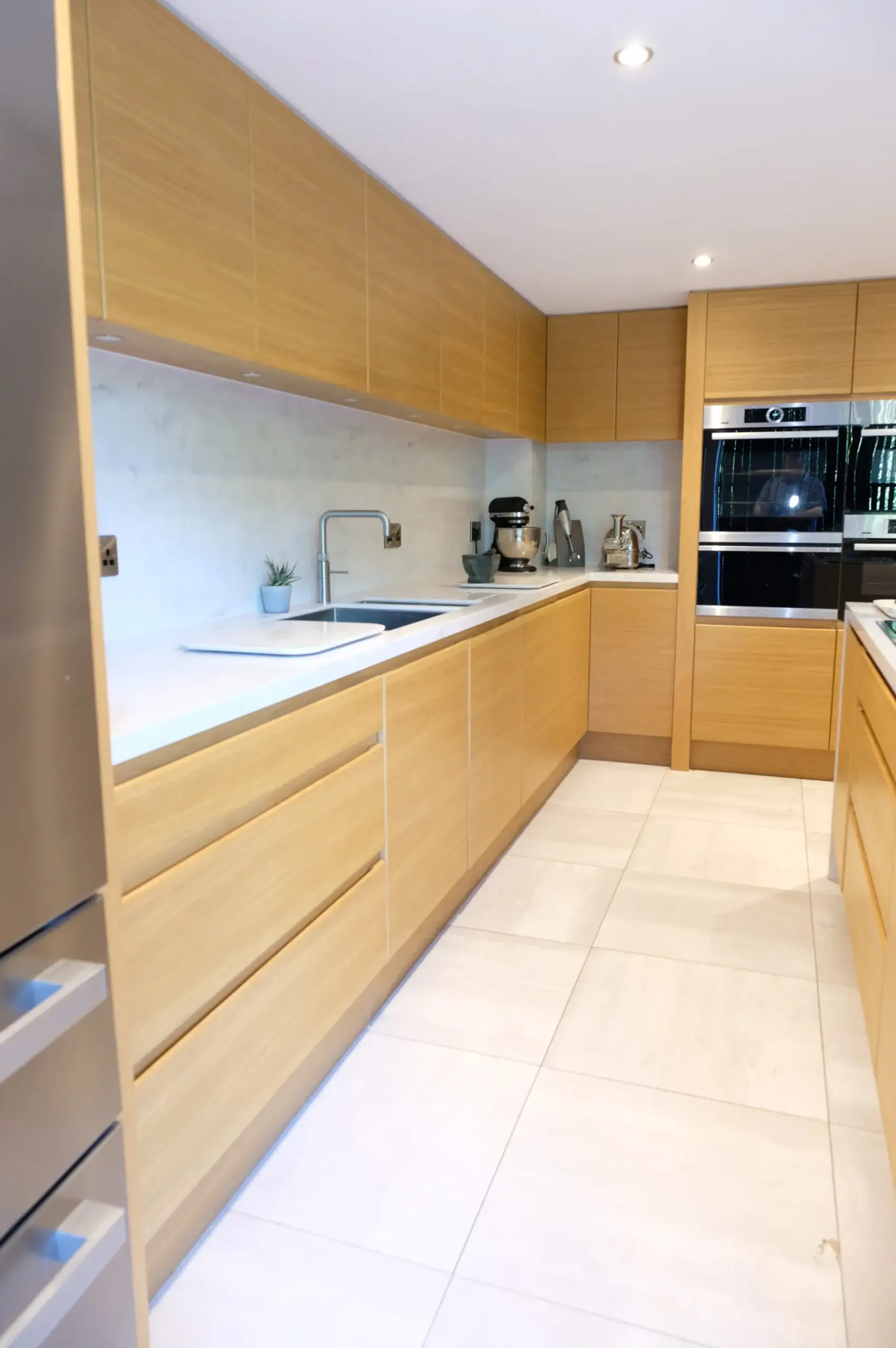 Scandinavian Style Kitchen With Light Oak Cabinetry And White Quartz Worktops Hygge Collection By Kenton Jones